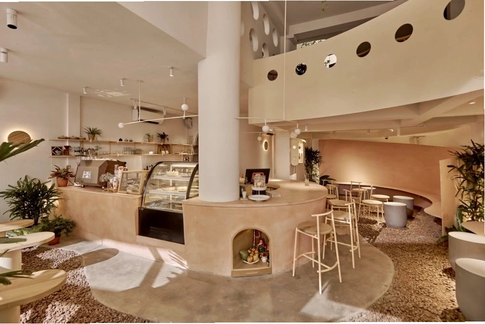 Chi tiết mặt tiền quán cafe tổ chim với các vòng tròn kim loại chuyển động