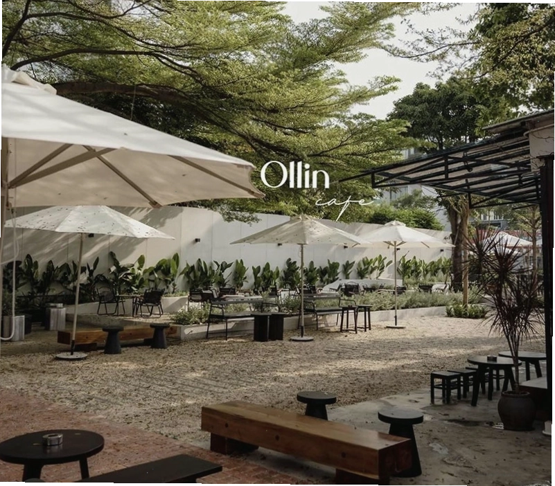 Khoảng sân rộng rãi và nhiều cây xanh tại Ollin Cafe Trần Não