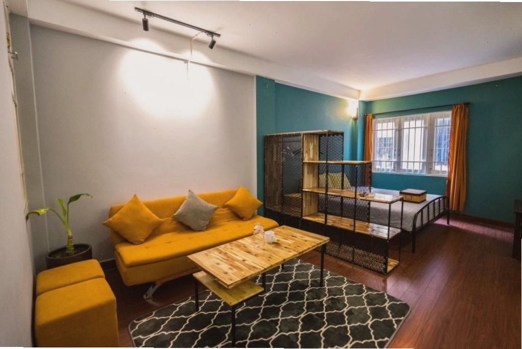 Không gian phòng khách và bếp mở tại Satori Homestay