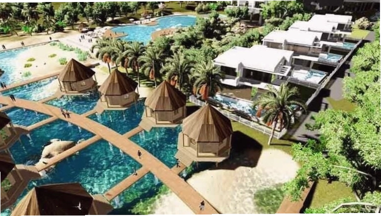Khuôn viên xanh mát của Hồ Cốc Beach Resort với lối đi rợp bóng cây