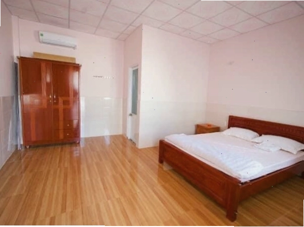 Mặt tiền Trang Homestay Bảo Lộc với không gian xanh mát