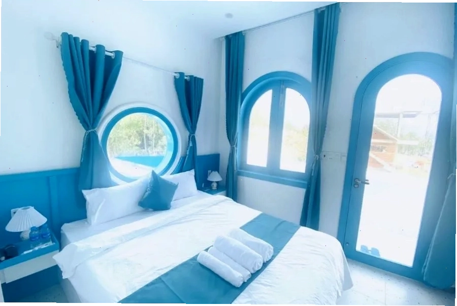 Robinson Homestay Cù Lao Mái Nhà với hồ bơi ngoài trời và vườn cây xanh mát